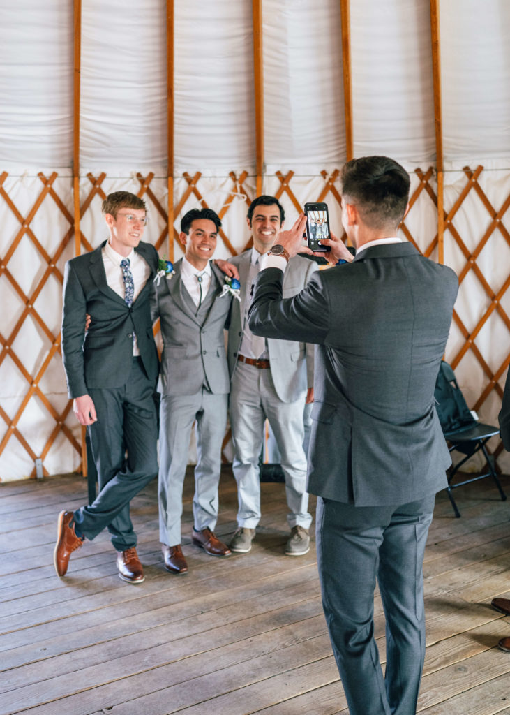 Groomsmen taking a picture together