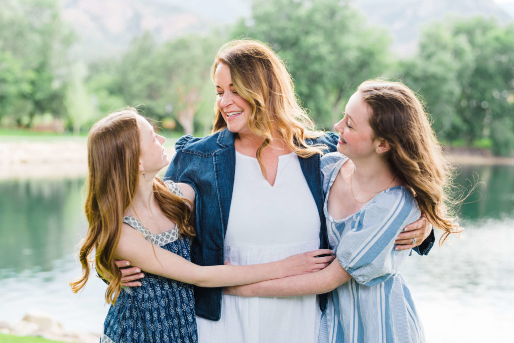 Mom hugging daughters at The Broadmoor
