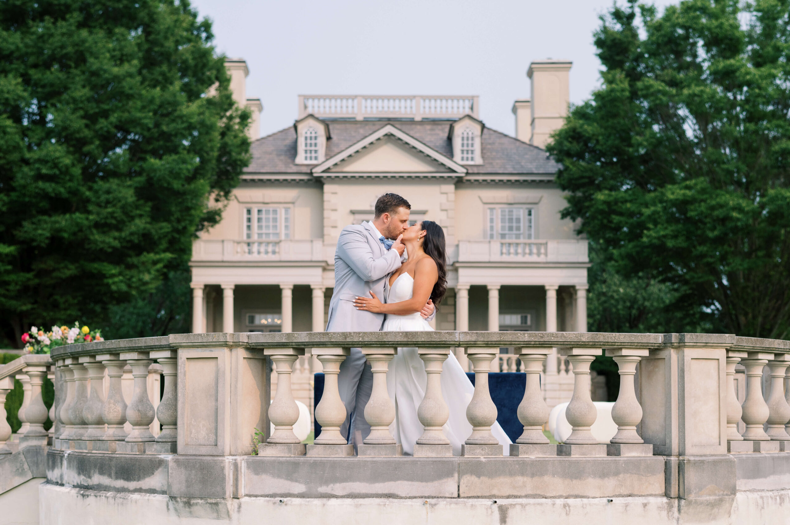 Couple kisses outside of their Northern Virginia Wedding Venue during their wedding