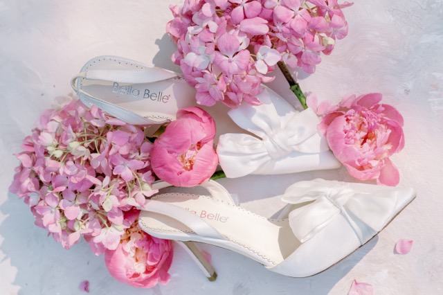 Pink flowers and beautiful shoes are photographed together at a Pippin Hill Farm Wedding in Virginia