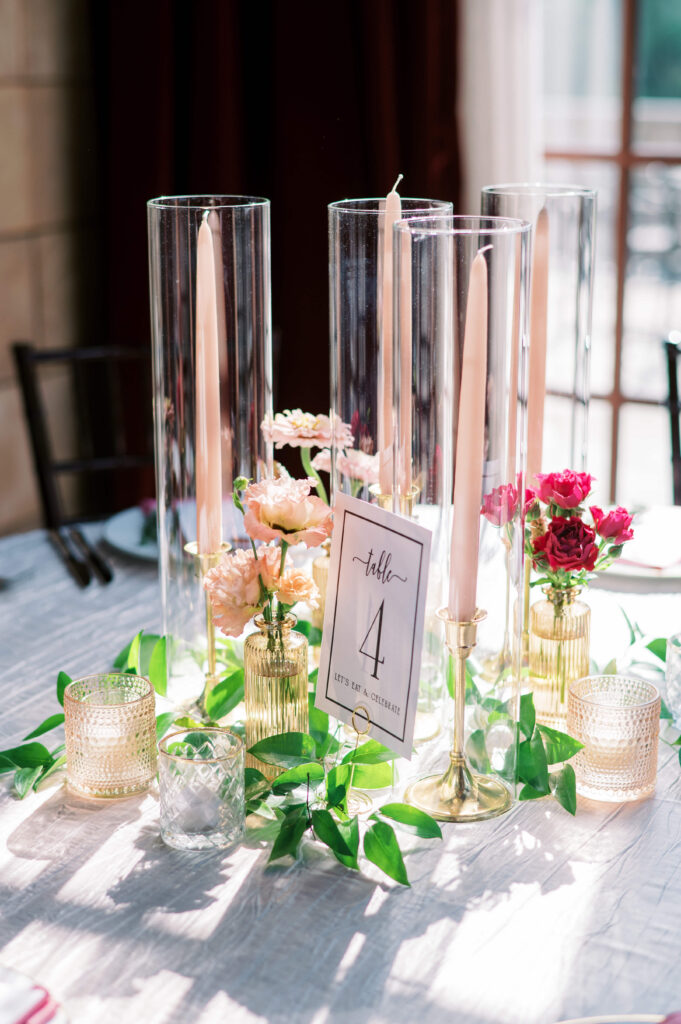 Light streams in through a window and illuminates the candles set atop a table at Dover Hall Estate